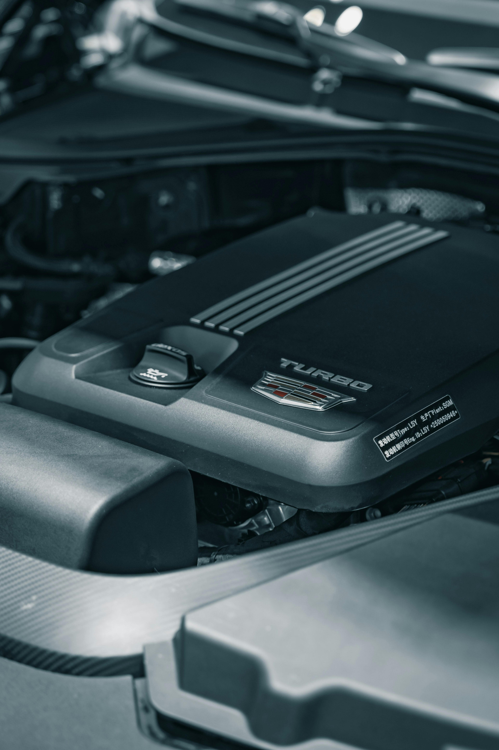 Close-up of a car turbocharged engine and components, highlighting the turbo system and intake plumbing