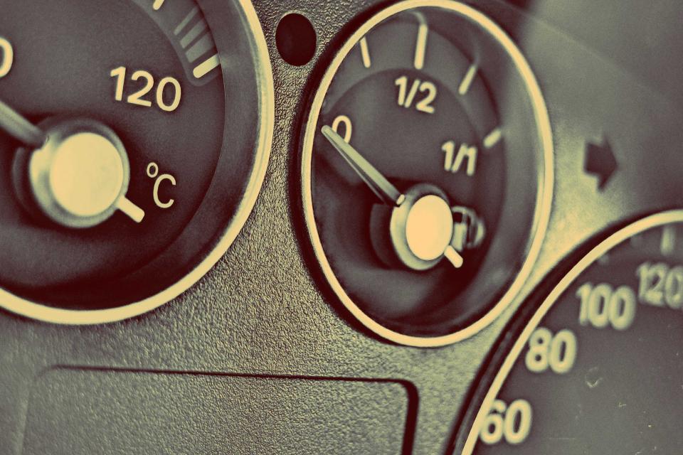Driver’s view of a vehicle dashboard and instrument cluster showing gauges and controls, suitable for articles about ECU tuning and diagnostics